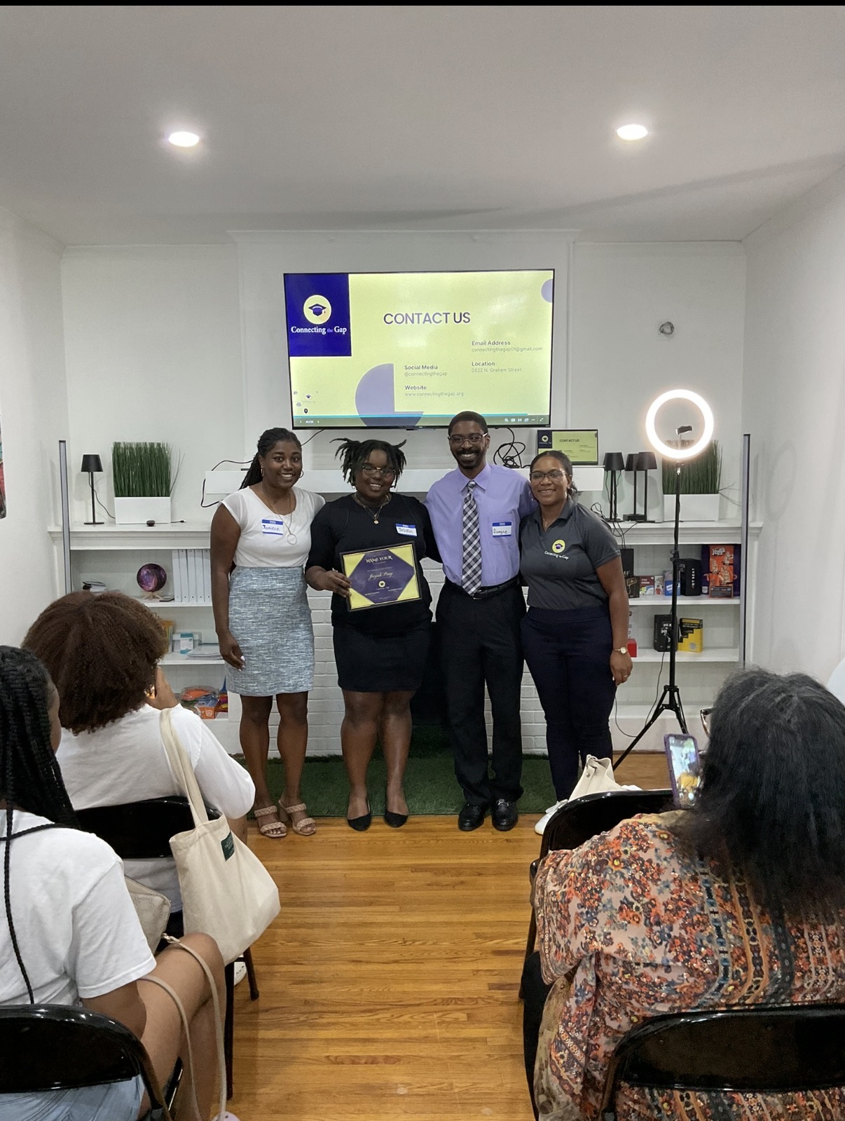 A recognition ceremony at the Connecting the Gap office.
